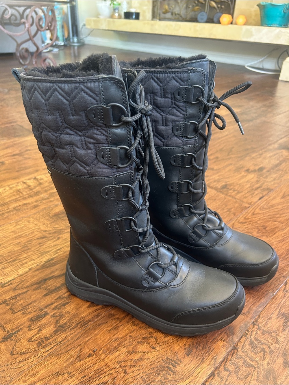 Like new! UGG Black leather Quilted Lace-Up Tall Winter Boots with wool lining.